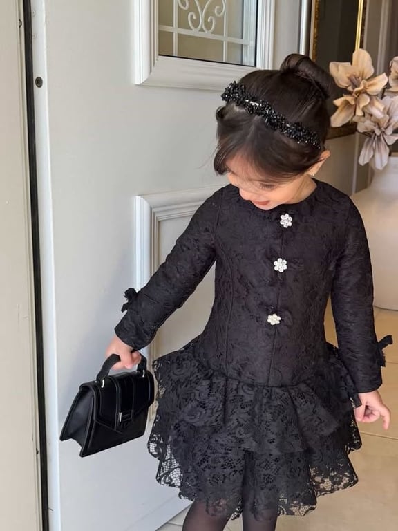 Photo by كوالا كفر قرع on March 22, 2026. May be an image of child, dress and text.