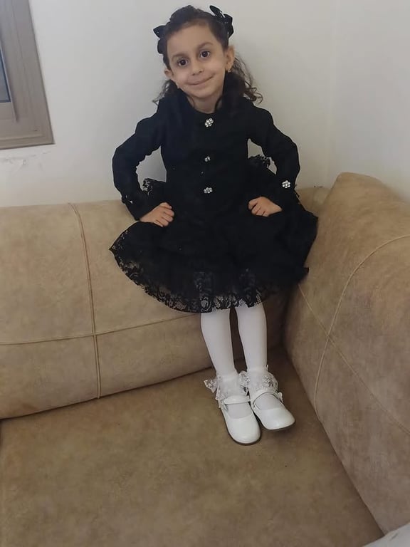 Photo by كوالا كفر قرع on March 22, 2026. May be an image of child, dress and text.